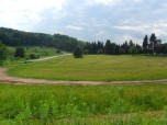 FIVE ACRE FIELD BESIDE LODGE in Background w/driveway. Track is at 10 O'Clock